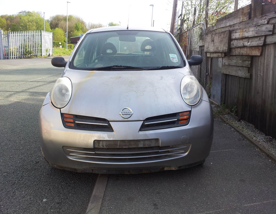 Nissan Micra E headlight-passenger-side-front